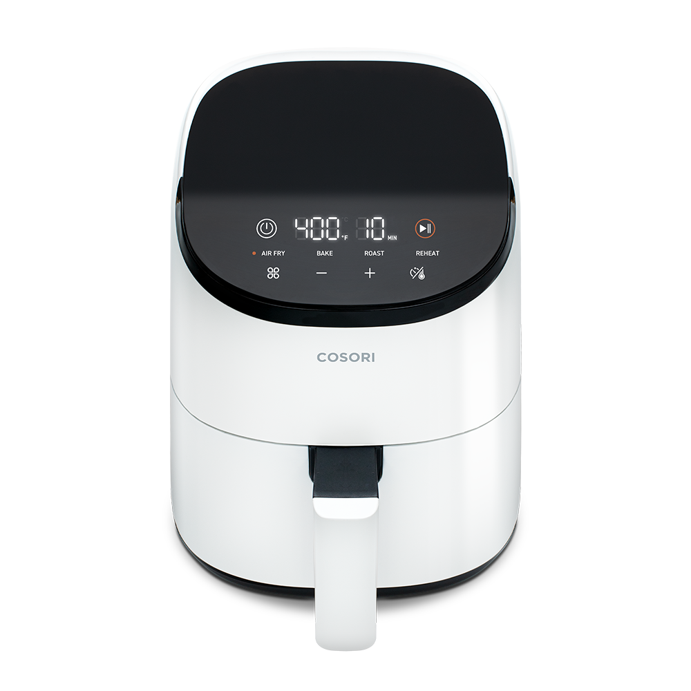 High-angle front view of the white Cosori Mini Air Fryer showing the sleek, modern housing